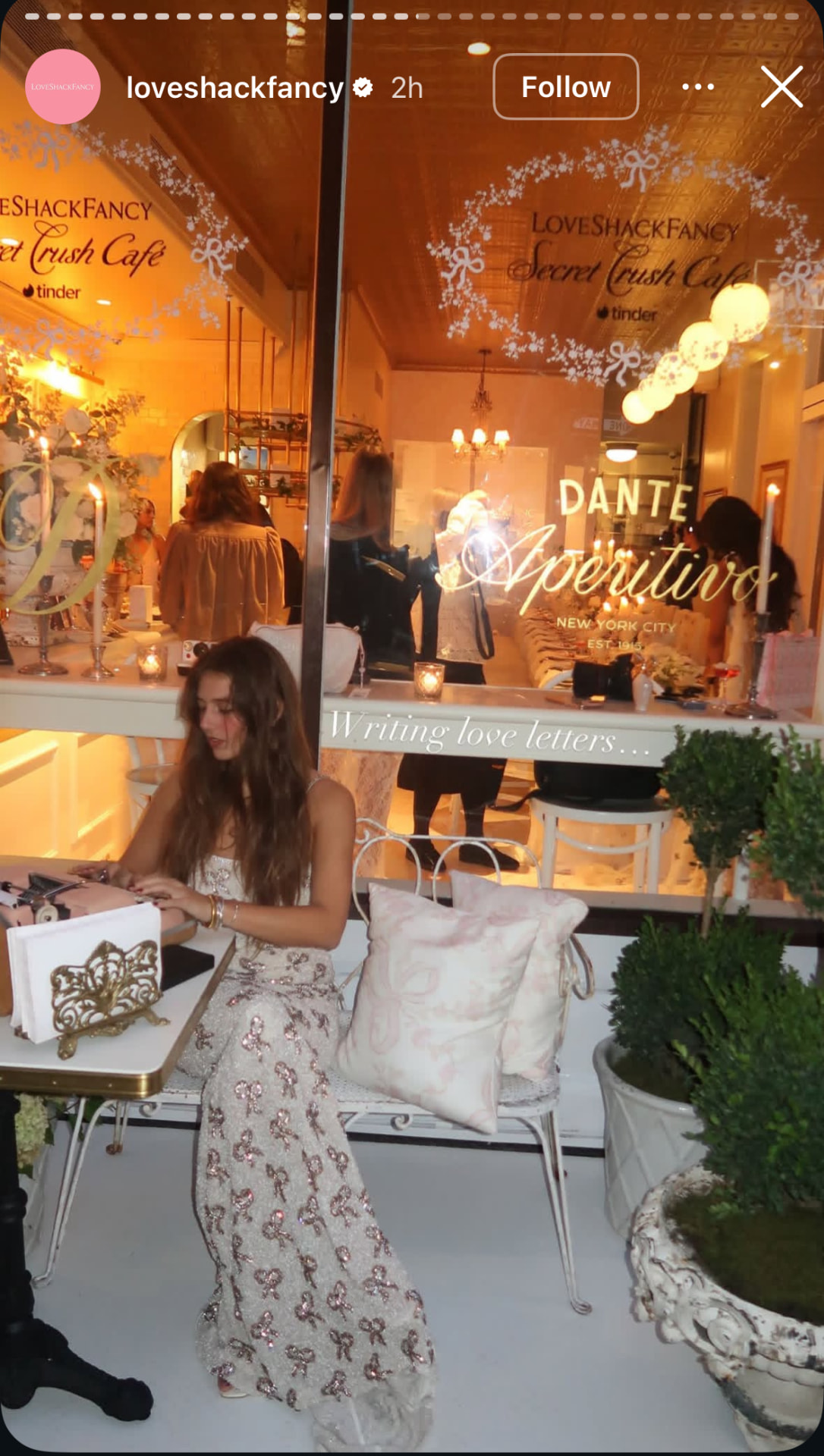 KT Dorfman writing love letters at a Love Shack Fancy shop opening