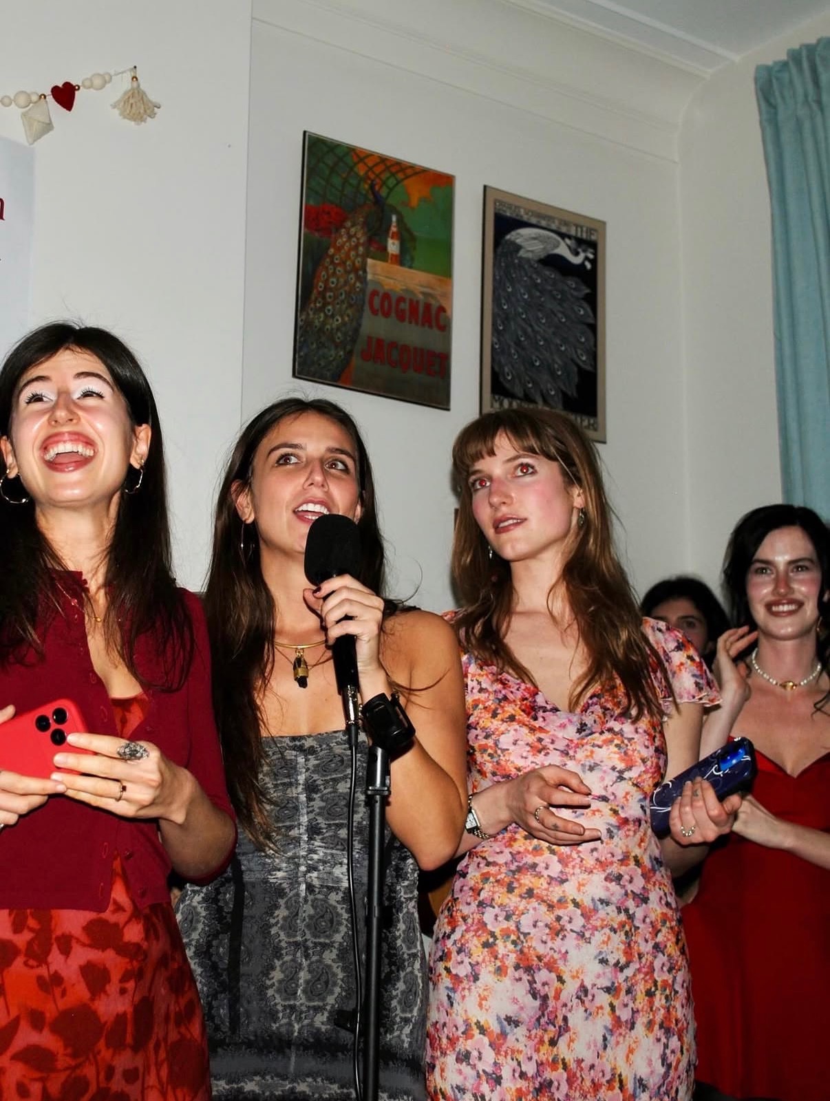KT Dorfman reading at a poetry event with friends