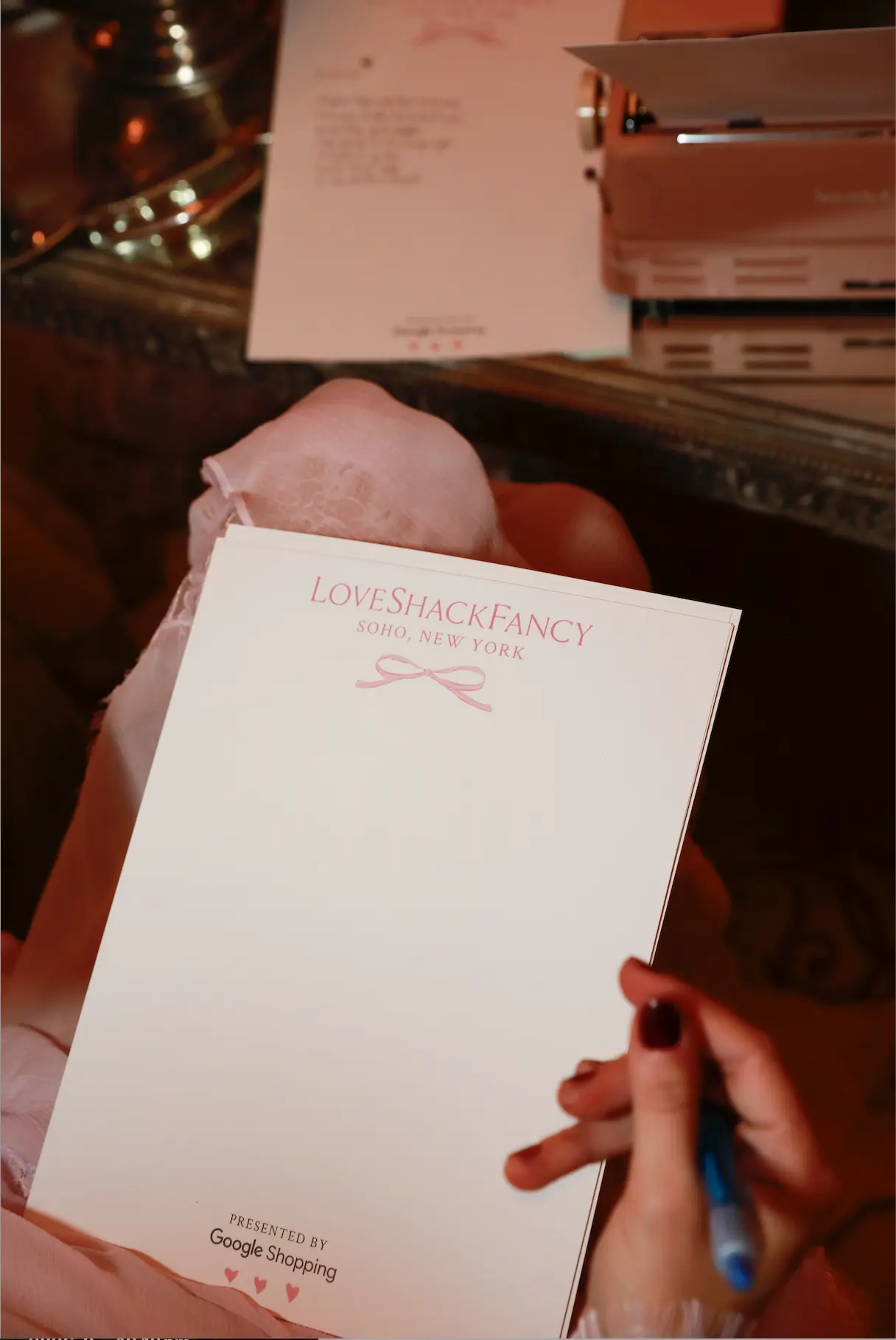 A Love Shack Fancy Soho, New York notepad with pink ribbon details