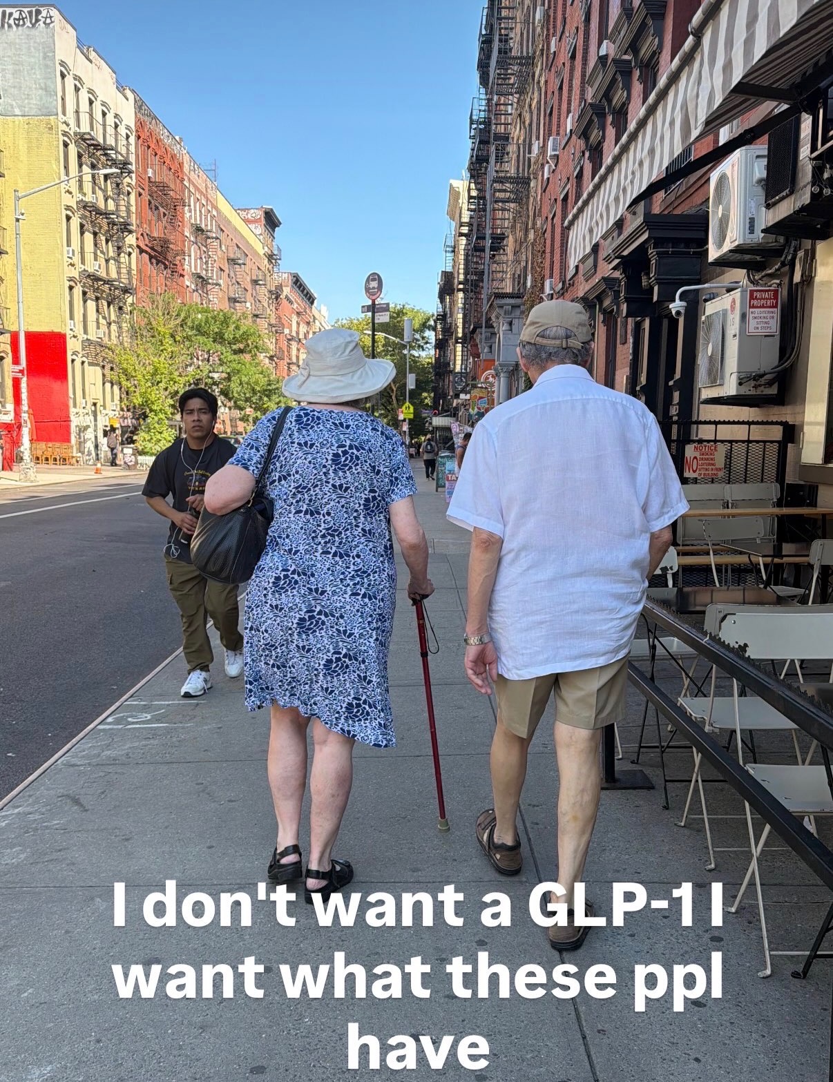 Street photo of an older couple with text: I don't want a GLP-1 I want what these ppl have