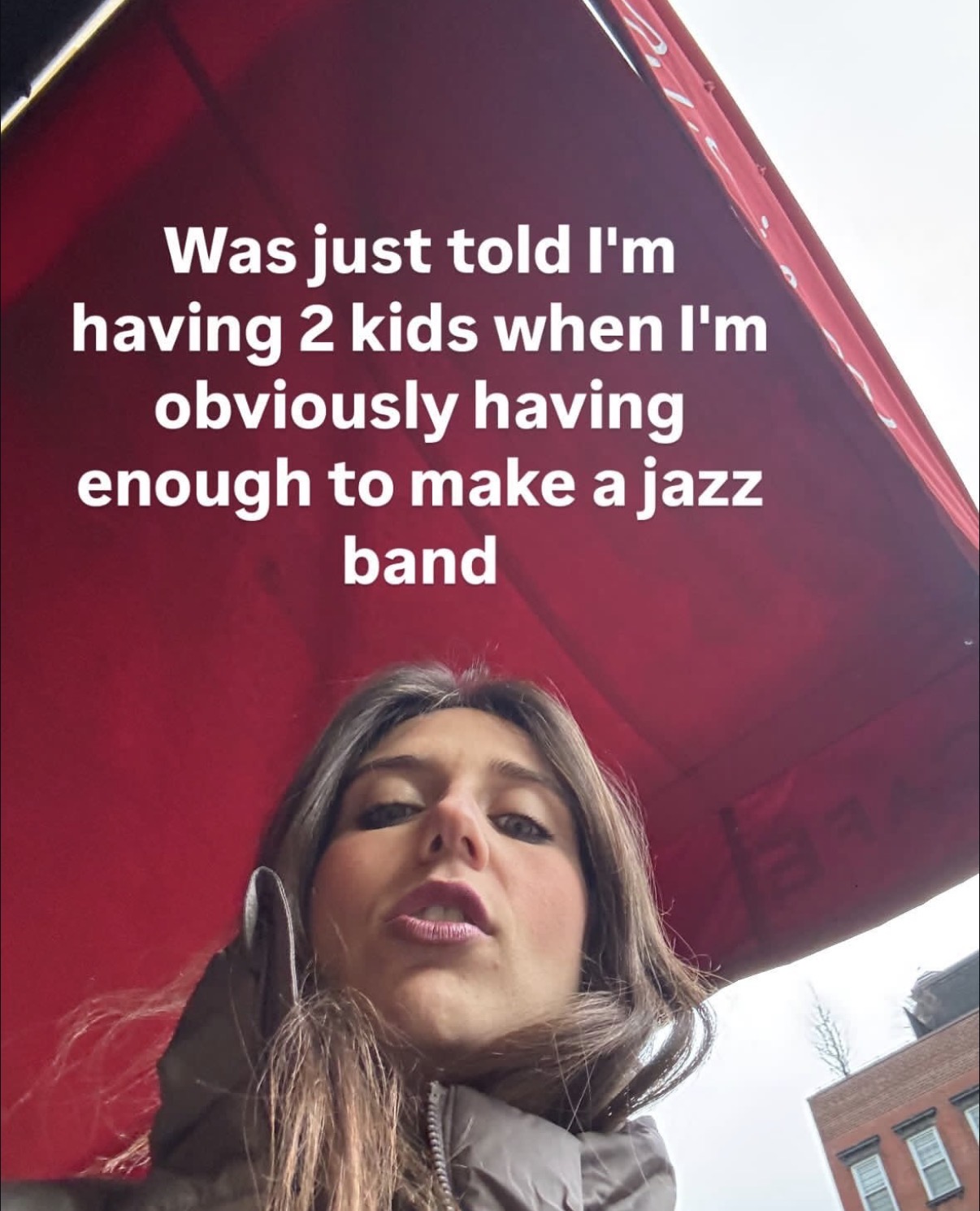 Selfie with red awning: having enough kids to make a jazz band