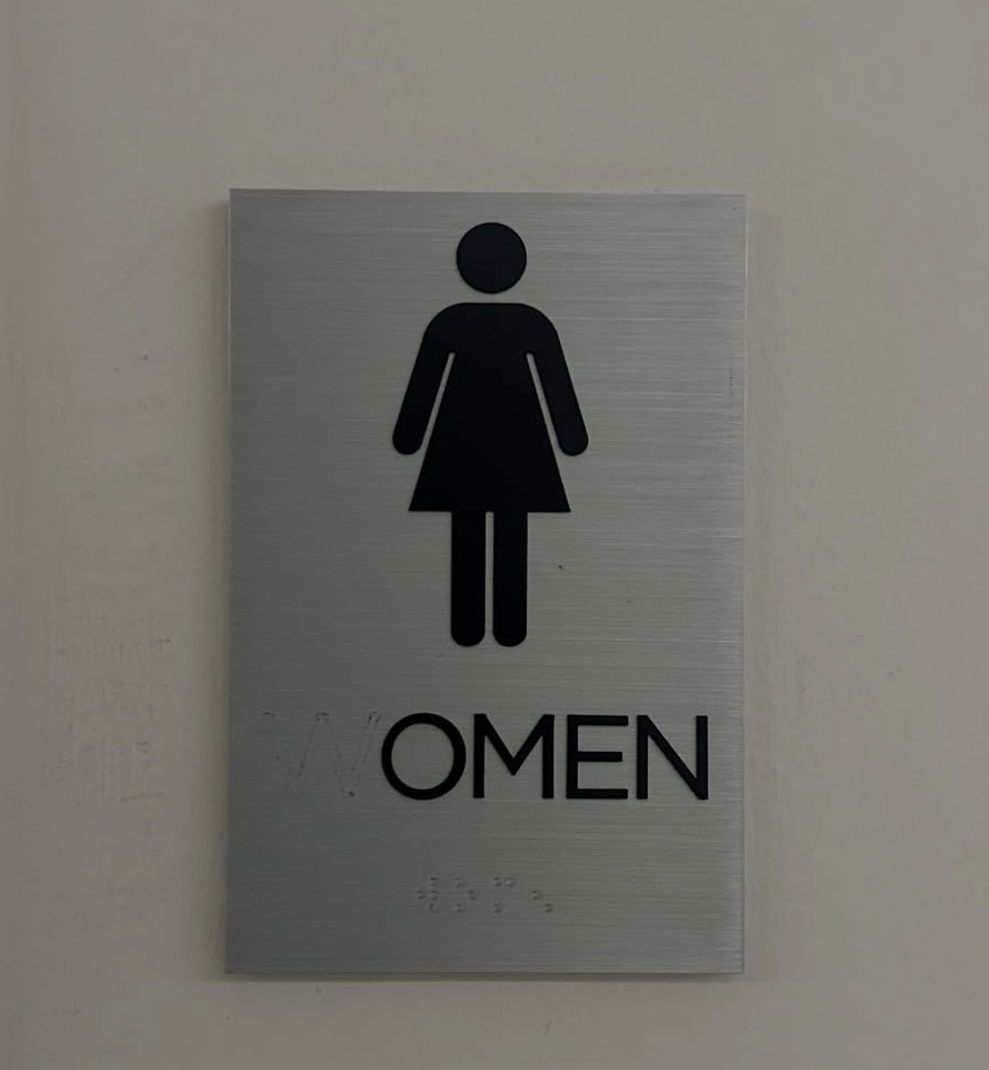 Women restroom sign missing its W